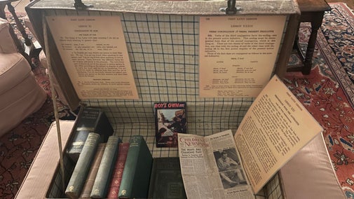 Suitcase open with artifacts from the second world war